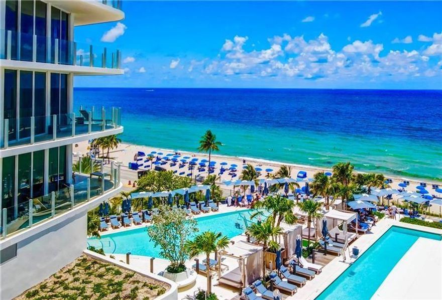 DIRECT OCEANFRONT PRIVATE RESIDENCE IN THE HIGHLY COVETED FOUR SEASONS, This fully furnished luxury residence offers two bedrooms with Den/3 Baths, and 40' wide terrace with stunning Atlantic Ocean views.