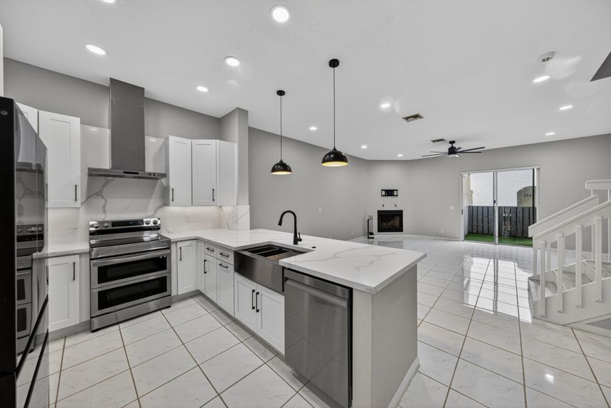 Located in prestigious Victoria Park, this spacious residence features an open floor plan with 2 bedrooms plus office/den and 2.5 baths. The office can easily be converted into a third bedroom. Updated in 2023, the kitchen offers white shaker cabinets, quartz countertops and backsplash, SS farmhouse sink & SS appliances. Features include high ceilings, recessed lighting, plantation shutters, electric blinds, and a wood-burning fireplace in the living room. Washer and dryer replaced in 2022. The patio features artificial grass and room for outdoor furniture. Boutique 13-unit community minutes from Las Olas, Galleria Mall, and Fort Lauderdale Beach.1 garage space + oversized driveway for 4 cars. Association completed stucco/paint in 2023 and pool renovation in 2024. OK to lease after 1 year.