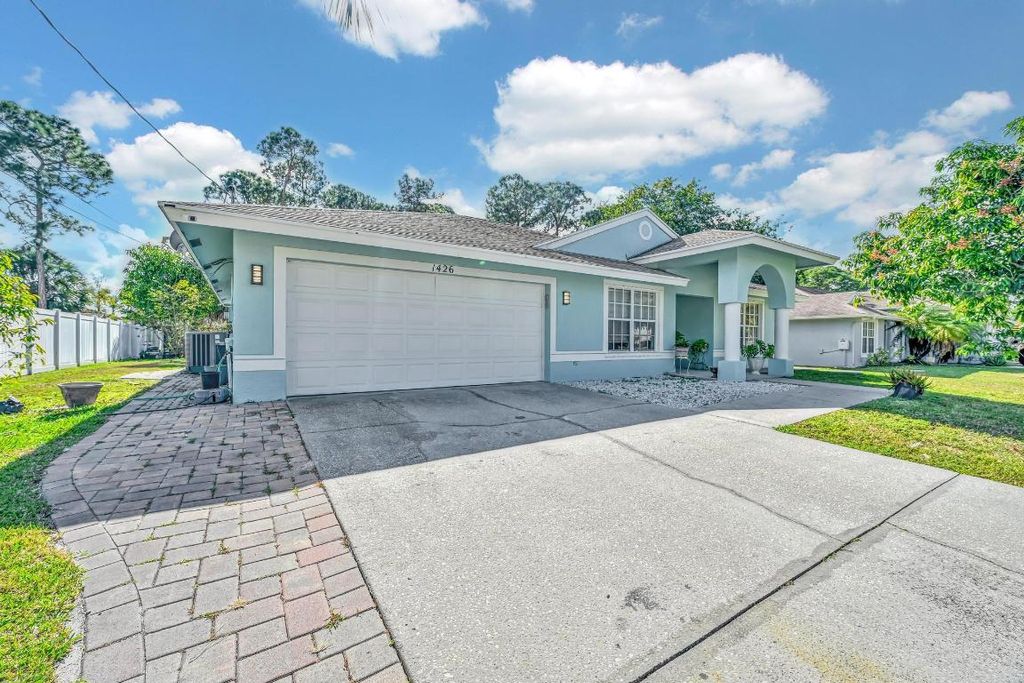 Photo of 1426 SW Melrose Avenue, Port Saint Lucie, FL 34953 (MLS # R11158490)