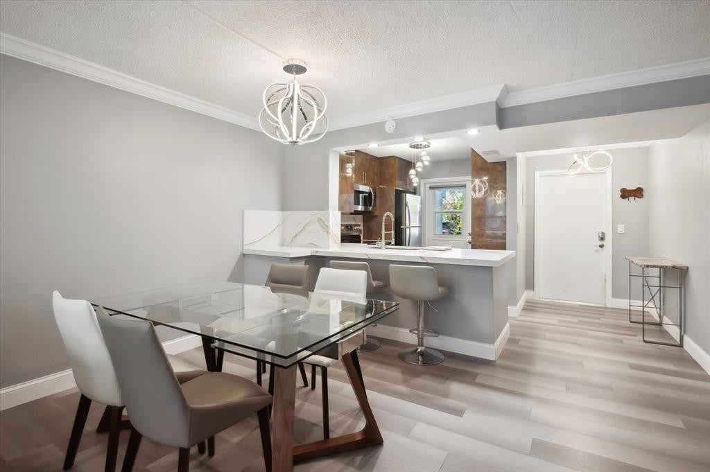 Photo of 4025 N FEDERAL Highway #123C, Oakland Park, FL 33308 (MLS # B26093822)