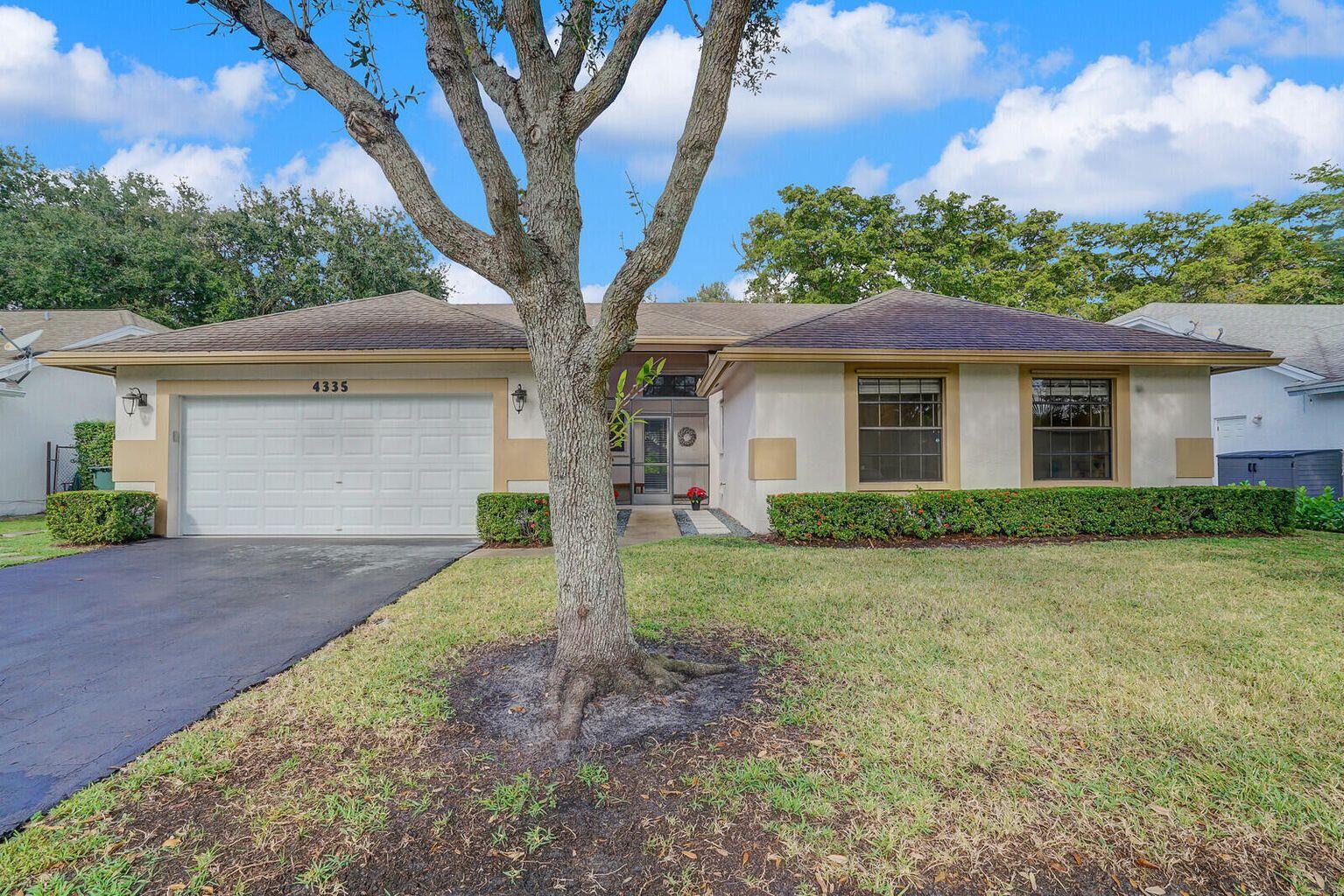 Nestled in Coconut Creek's Winston Park community this spacious 4-bedroom, 2-bathroom home with a 2 car garage is ready for its new owner! Step in as you're greeted by a generous amount of natural light coming in through the living areas which includes a formal living room, dining room, and family room. The kitchen was renovated with new cabinets and stainless steel appliances. Enjoy privacy with the bedrooms being secluded from the main living areas of the home. The spacious primary bedroom has views of the backyard and a large walk in closet leading to the primary bathroom with dual sinks and a walk in shower. The other three bedrooms are generously sized with plenty of natural light. Clusia hedges make the backyard a private setting with space to build a pool.