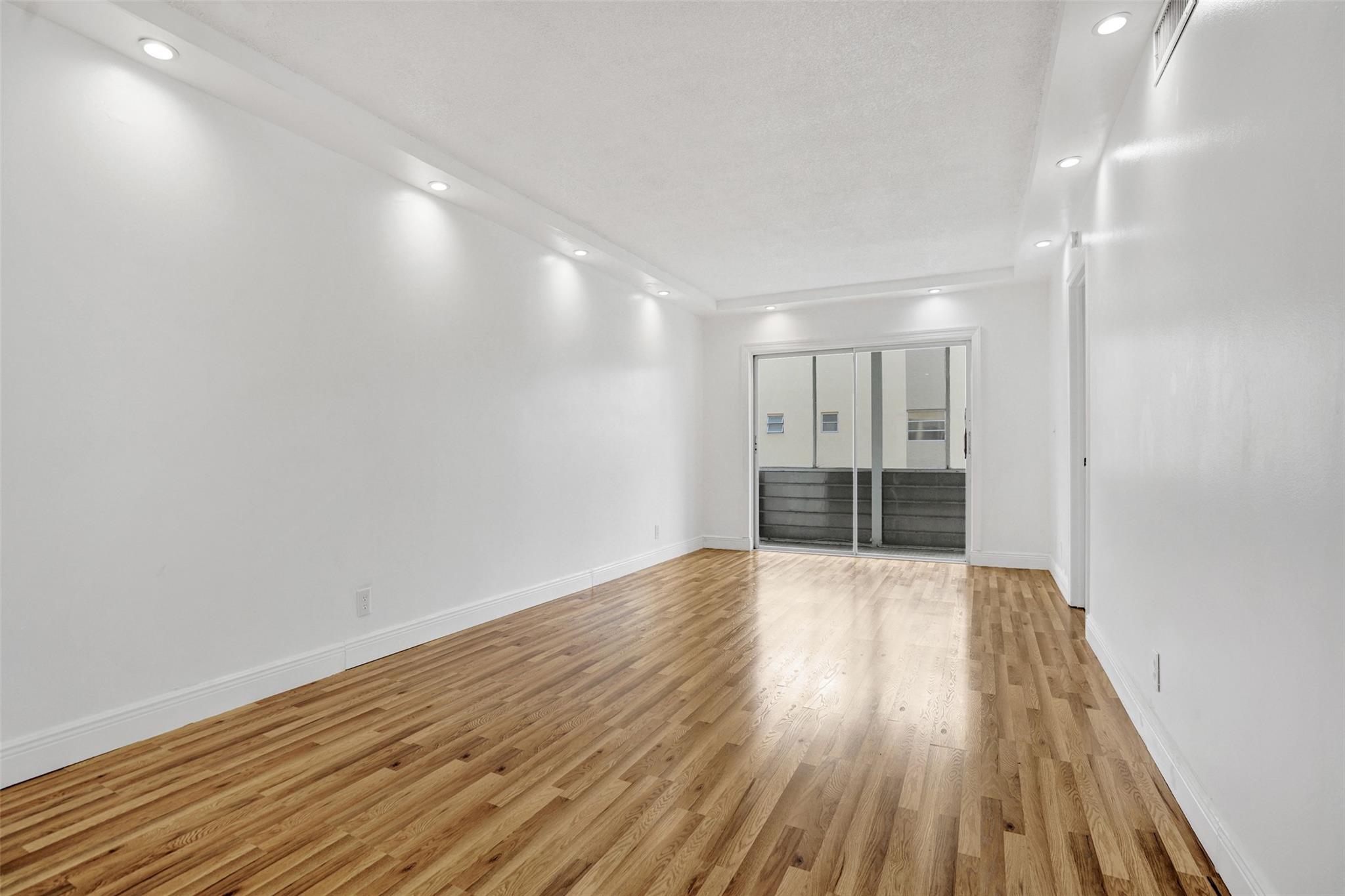 Welcome to easy living in this beautifully updated 2bedroom/2bathroom condo nestled in the sought-after gated 55+ community of Carriage Hills! Move-in ready and centrally located in Hollywood near highways, casinos, dining, entertainment, beaches & more! New floors throughout, both bathrooms feature newer tile, toilets, and granite countertops. Enjoy a screened-in balcony for fresh air, recessed lighting, fresh paint, and a clean & well maintained building with elevator, and laundry on the same floor. Just steps from the nearest pool; it also includes a storage unit & assigned parking. The Amenities at Carriage Hills are wonderful and include pools, spa, tennis, shuffleboard, clubhouse, gym, billiards, community bus & walking paths. Delightful place to live, easy to show, inquire today!