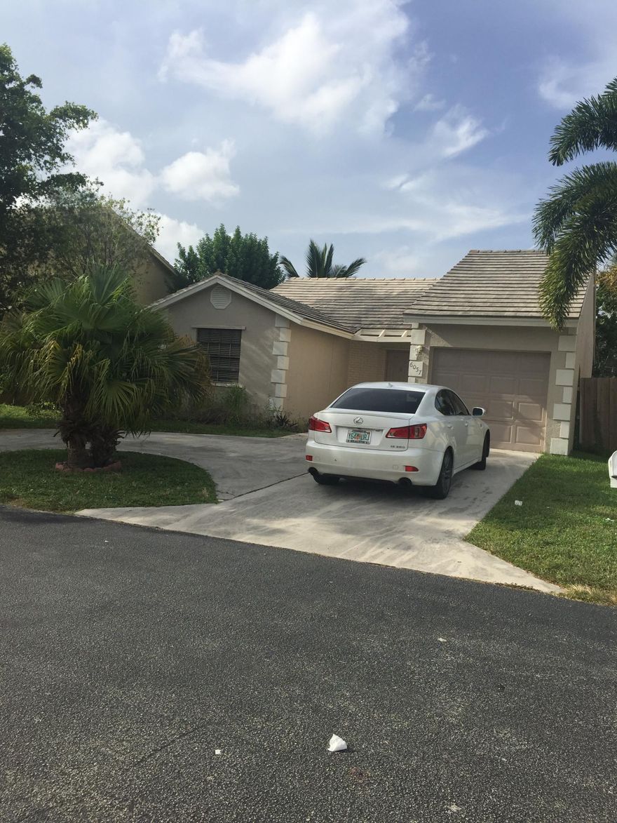 3/2 WITH GARAGE CONVERTED INTO BEDROOM. ALL TILED FLOORS, NO CARPET. SEPARATE DINING AND LIVING ROOMS, VAULTED CEILINGS. FENCED BACK YARD, SCREENED PATIO  COVERINGS, LANDSCAPING . DRIVEWAY FITS 2-3 CARS.