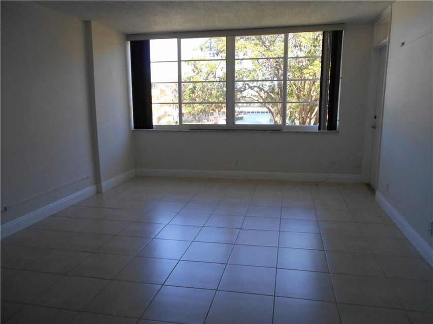 BACK ON THE MARKET !RENOVATED UNIT IN WATERFRONT COMPLEX. CONDO FEATURES NEWER TILE FLOORS THROUGHOUT, LARGE SCREENED BALCONY WITH BEAUTIFUL POOL AND WATER VIEWS, HIGH IMPACT WINDOWS ! OPEN KITCHEN WITH NEWER REFRIGERATOR, 1/2 BATH OFF THE LIVING ROOM , LOTS OF CLOSETS AND MORE... COMMUNITY OFFERS 2 POOLS (ONE HEATED) , RENOVATED CLUBHOUSE , BBQ GRILLS, LAUNDRY FACILITIES , BASIC CABLE, WATER AND PEST CONTROL INCLUDED IN THE RENT.