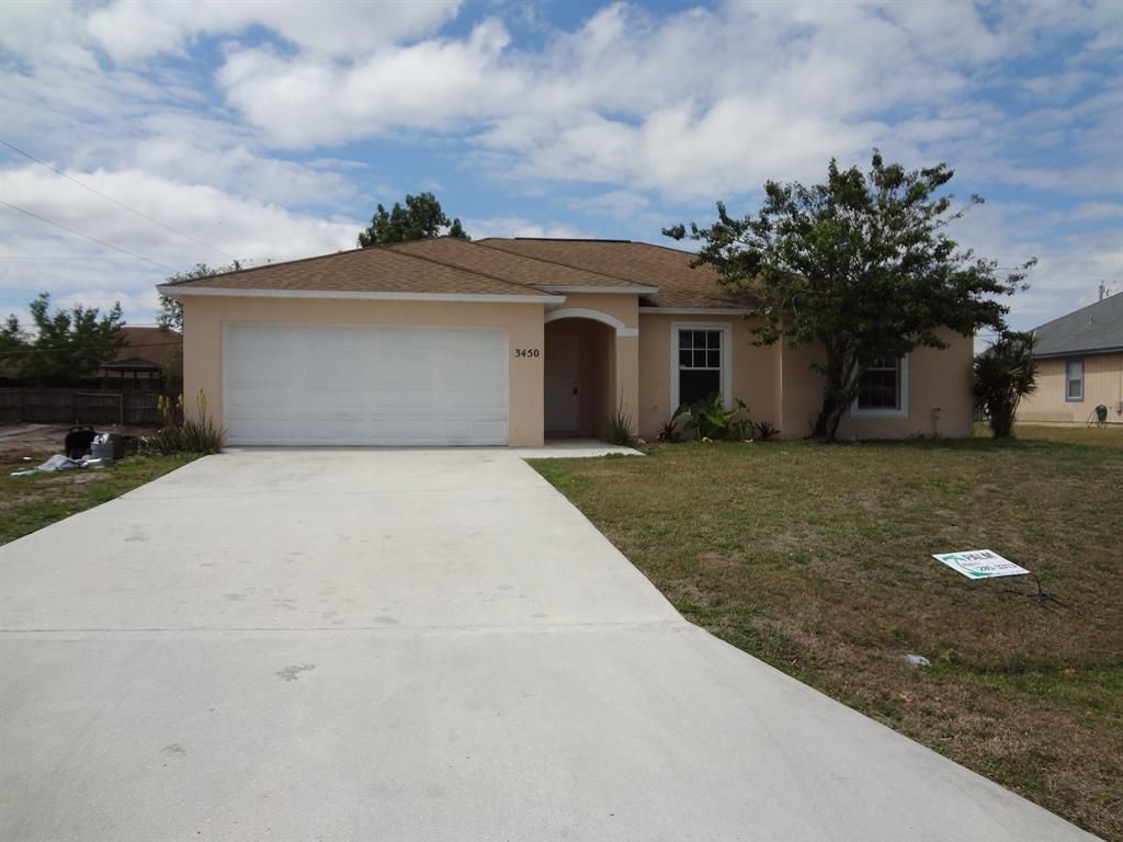 Photo of 3450 SW San Georgio Street, Port Saint Lucie, FL 34953 (MLS # R10704382)