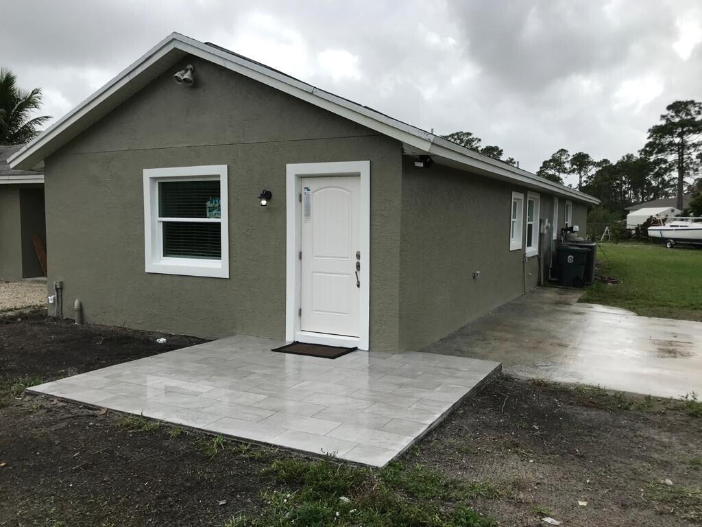 Photo of 17024 89TH Place N #A, The Acreage, FL 33470 (MLS # B26078536)