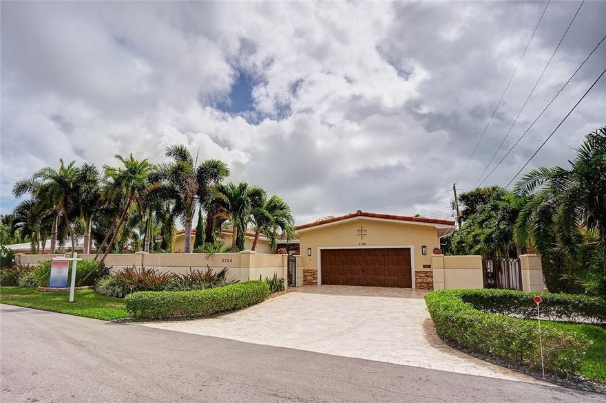 Don't miss this total renovation of a mid-century charmer in the Bayview School District! Handsome 3BR/2BA/2Car Garage private, salt water Pool & Spa home is situated behind a stately masonry wall with custom, decorative iron gate and travertine walkway leading to a double glass entryway.  Manicured landscaping includes 6 Italian Cypresses and 70+ palm trees! Vaulted, beamed ceilings add charm and drama to the Great Room! Huge Master Shower w/soaking tub! Impact windows and doors w/sun blocking shades! Underground Electric and Cable Service! 6 Camera Security System and Bose surround sound system in all rooms and patio! New Sewer/Water lines to street! All New Systems/Roof 2015! Too many upgrades to list (see attachment).  BEST VALUE in Coral Ridge - call today for your private showing!