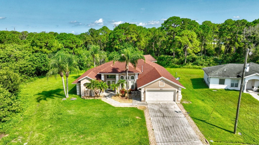 Photo of 6119 NW GAUSE Avenue, Port Saint Lucie, FL 34986 (MLS # B26064973)