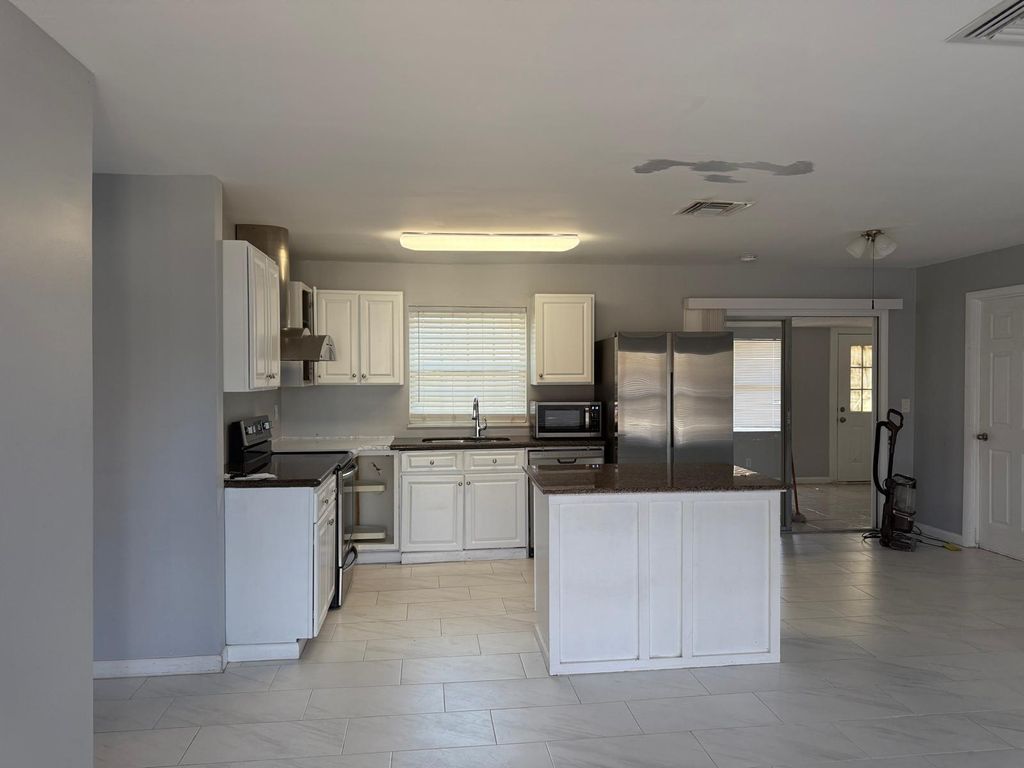 Photo of 107 NW Curtis Street, Port Saint Lucie, FL 34983 (MLS # R11165541)