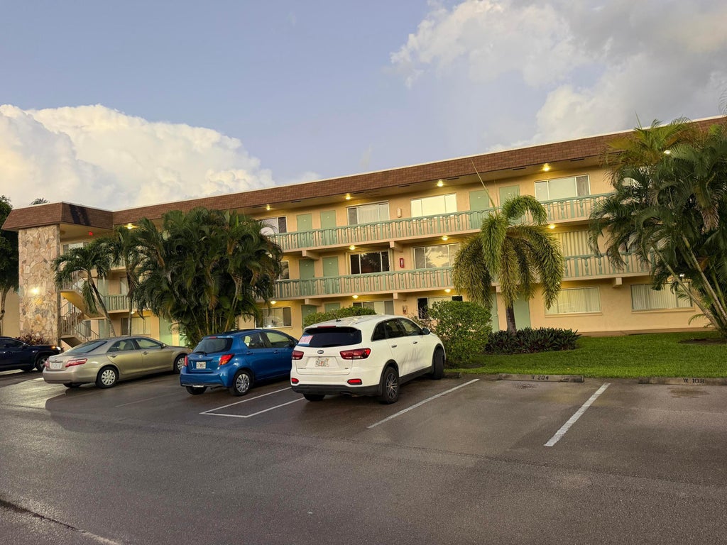 Photo of 400 VILLAGE GREEN Circle W #205, Palm Springs, FL 33461 (MLS # B26092326)
