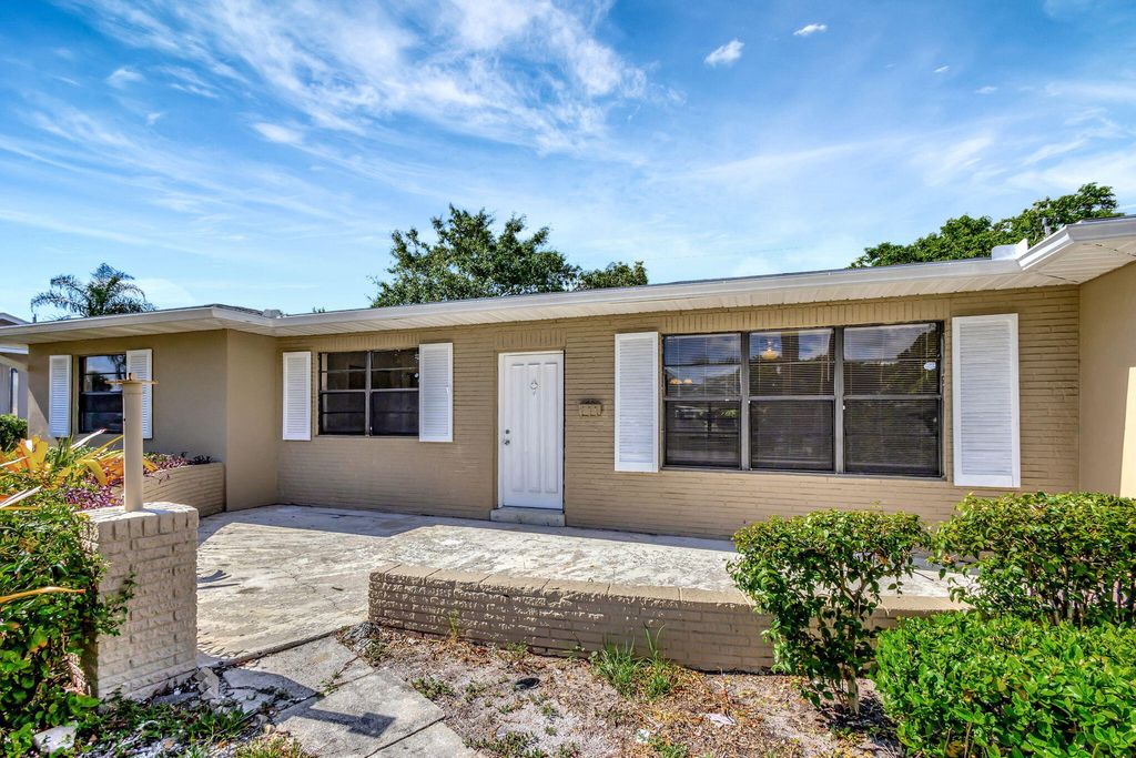 Photo of 848 Hawthorne Drive, Lake Park, FL 33403 (MLS # R10995812)