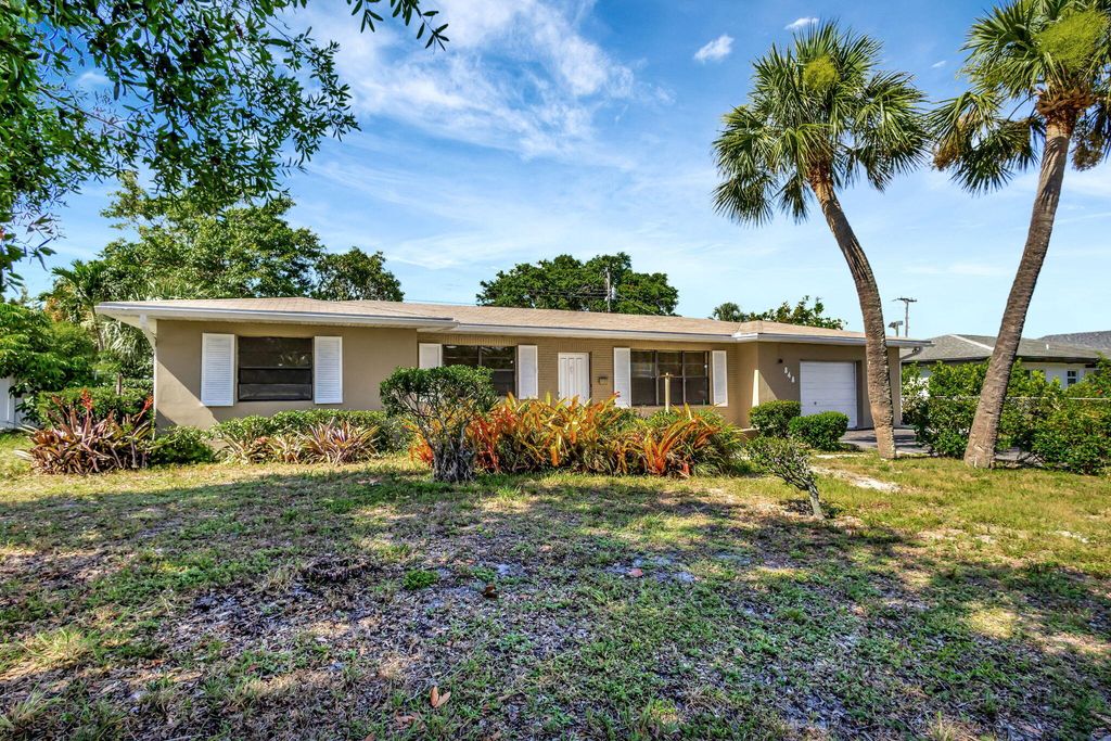 Photo of 848 Hawthorne Drive, Lake Park, FL 33403 (MLS # R10995812)