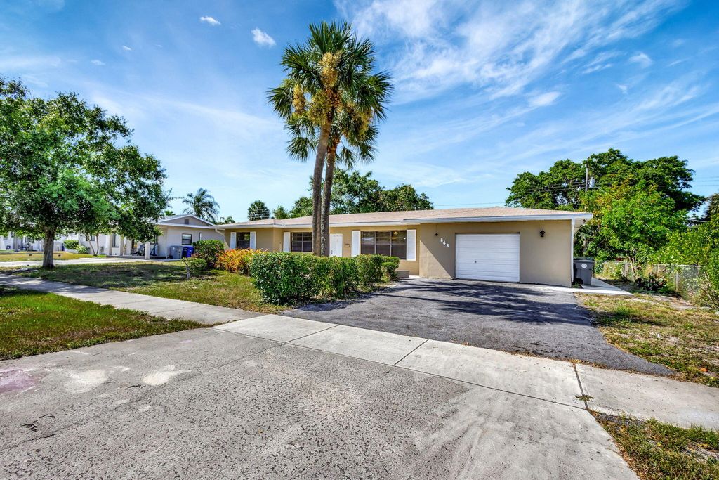 Photo of 848 Hawthorne Drive, Lake Park, FL 33403 (MLS # R10995812)