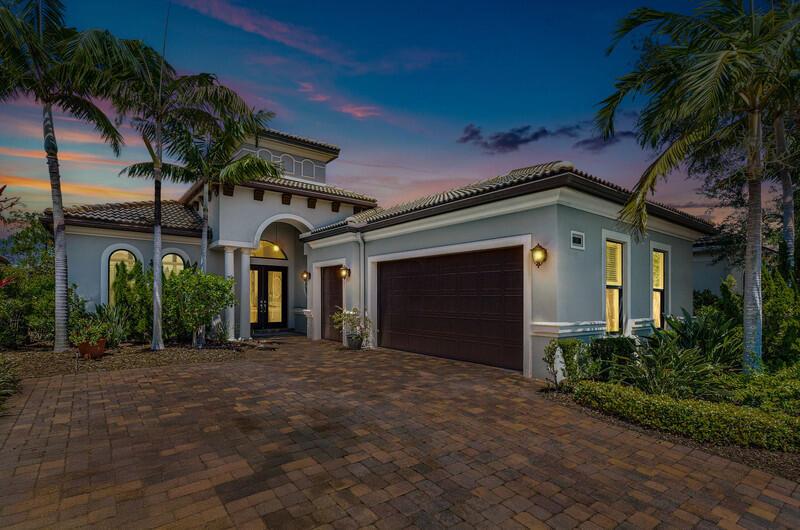 Discover luxury in this award-winning floor plan with nearly 2,600 square feet. This exquisite home features three spacious bedrooms, three and a half bathrooms, a den, and both a two-car garage and a dedicated golf garage. The gourmet kitchen boasts newly refinished cabinets and a central breakfast bar, flowing into an elegant formal dining room. The great room includes a stylish wet bar with granite countertops & a wood-cast accent wall. Each guest suite offers comfort with an ensuite bathroom and ample closet space. The primary suite exudes sophistication with a tray ceiling and generous closets, while the opulent primary bathroom features double vanities, elegant stone countertops, an oversized glass shower, and a soaking tub. This home beautifully blends elegance & functionality.