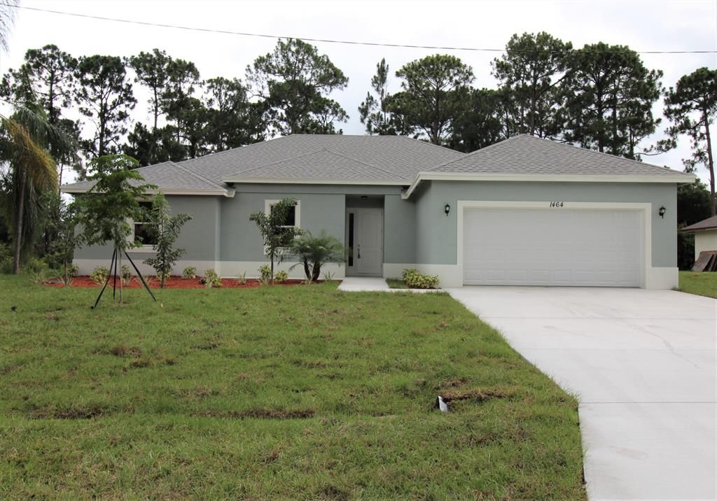 Photo of 974 SW Firestone Avenue, Port Saint Lucie, FL 34953 (MLS # R10717754)