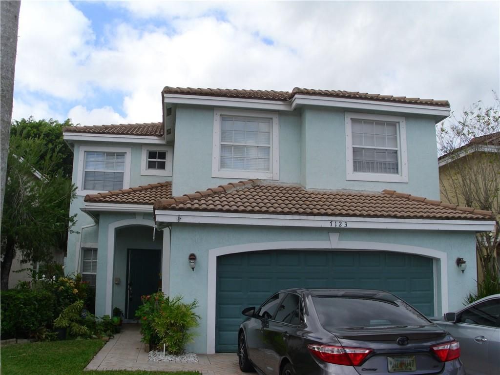 Photo of 7123 Crescent Creek Ln, Coconut Creek, FL 33073 (MLS # F10312735)