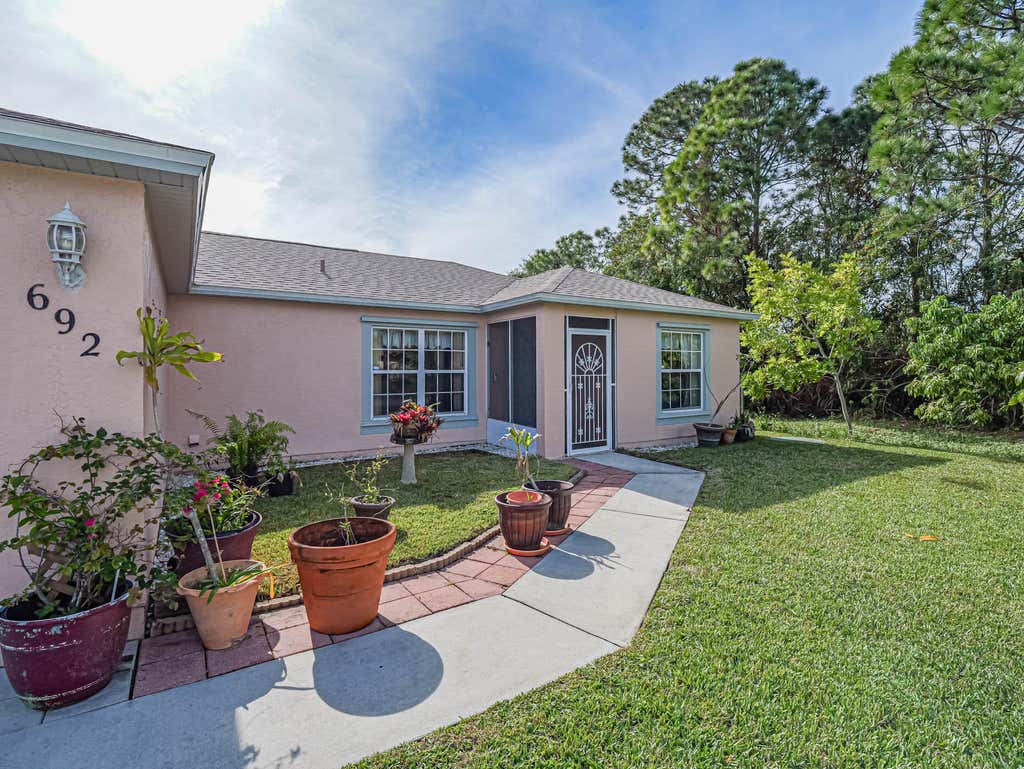 Photo of 692 NW Placid Avenue, Port Saint Lucie, FL 34983 (MLS # R10942468)