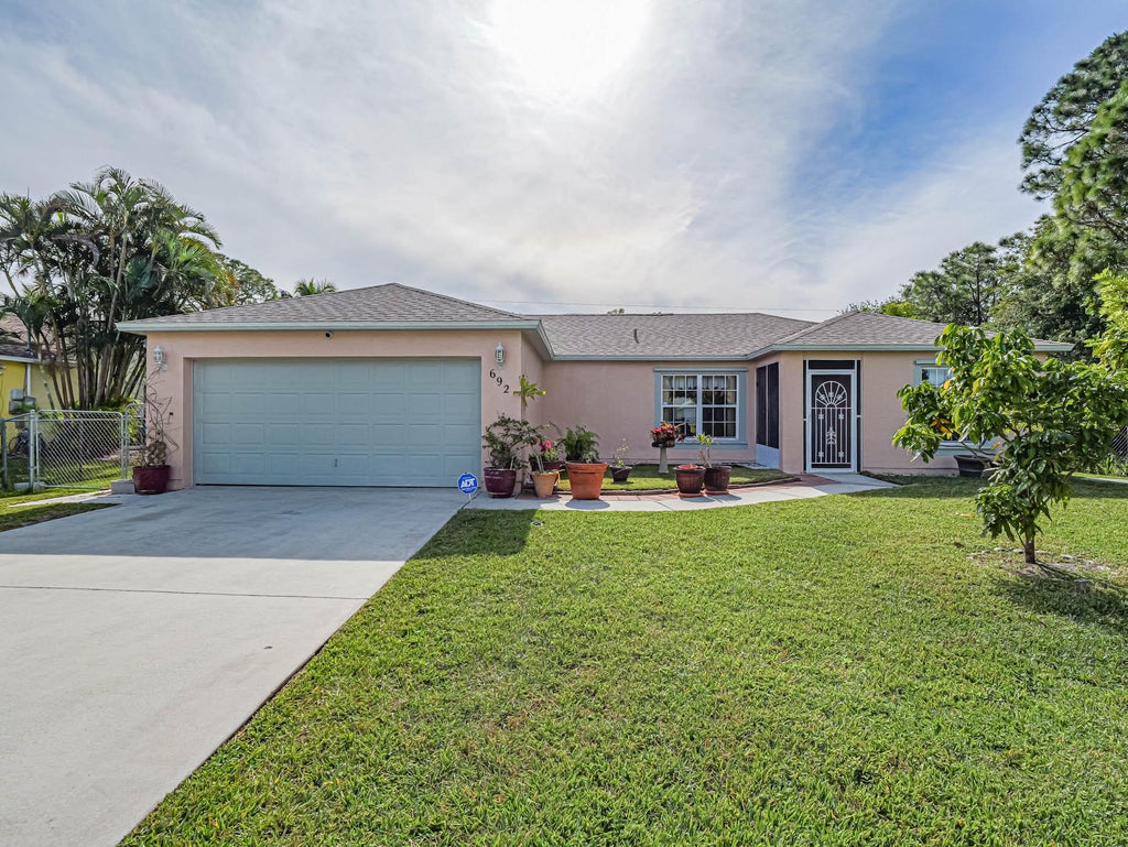 Photo of 692 NW Placid Avenue, Port Saint Lucie, FL 34983 (MLS # R10942468)
