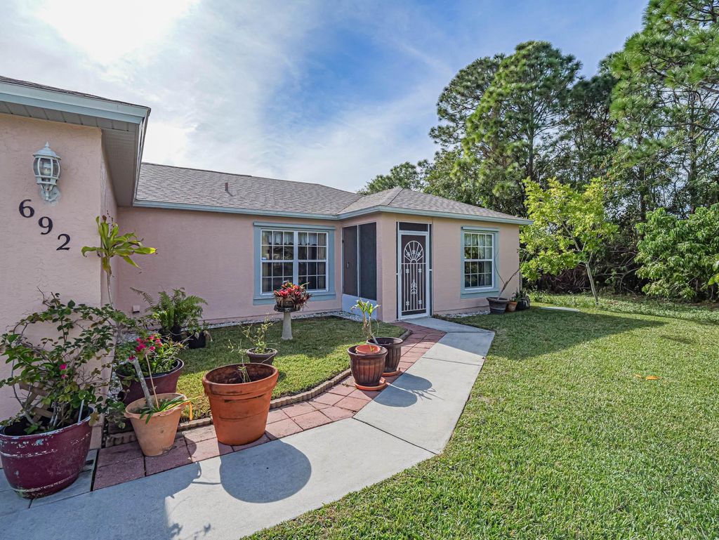 Photo of 692 NW Placid Avenue, Port Saint Lucie, FL 34983 (MLS # R10942468)