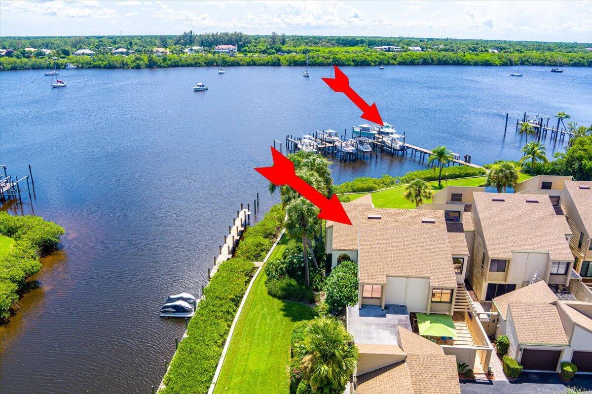 ATTENTION TO DETAIL - ON STEROIDS. UBER UPGRADED OCEAN ACCESS 3/3/1 Wide Water Townhome On Kitching Cove. 2024 16000 lb Boat Lift (annual serviced 5/25; water and electric connected). Everything About This Home Is TURNKEY. 2023 Roof; 2025 BOTH HVAC UNITS REPLACED. 2025 WASHER/DRYER. Murphy Bed In Downstairs Bdrm. Flat Rooftop Sealed. Gorgeous Kitchen + Water Views. All New Accordion Shutters. Epoxy-Sealed Garage Floor W/ Storage Cabinets. Pride Of Ownership. This Home Shows Like A Model - WOW FACTOR. Too Many Upgrades To List. (2016 Boston Whaler In Pics Is Also Available For Sale via Marine Max - Stuart $269K. Ask Agent For Details.) Best Dock Location In Community.