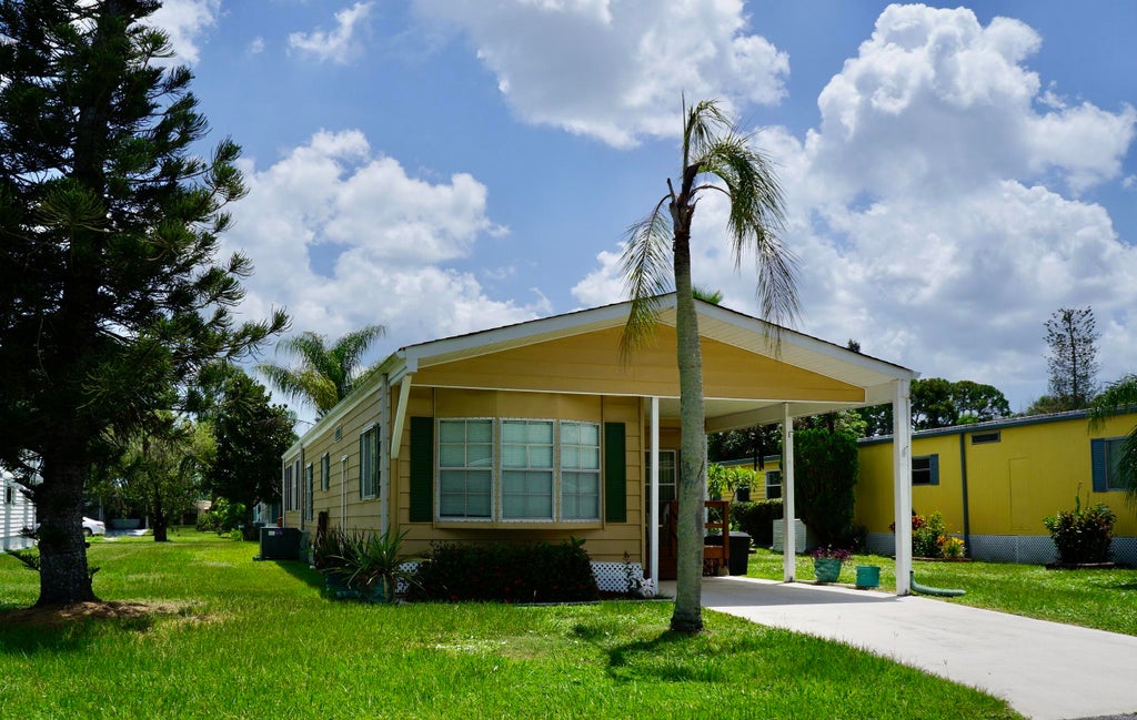 Photo of 21 SE Iberian Lane, Port Saint Lucie, FL 34952 (MLS # B26065846)