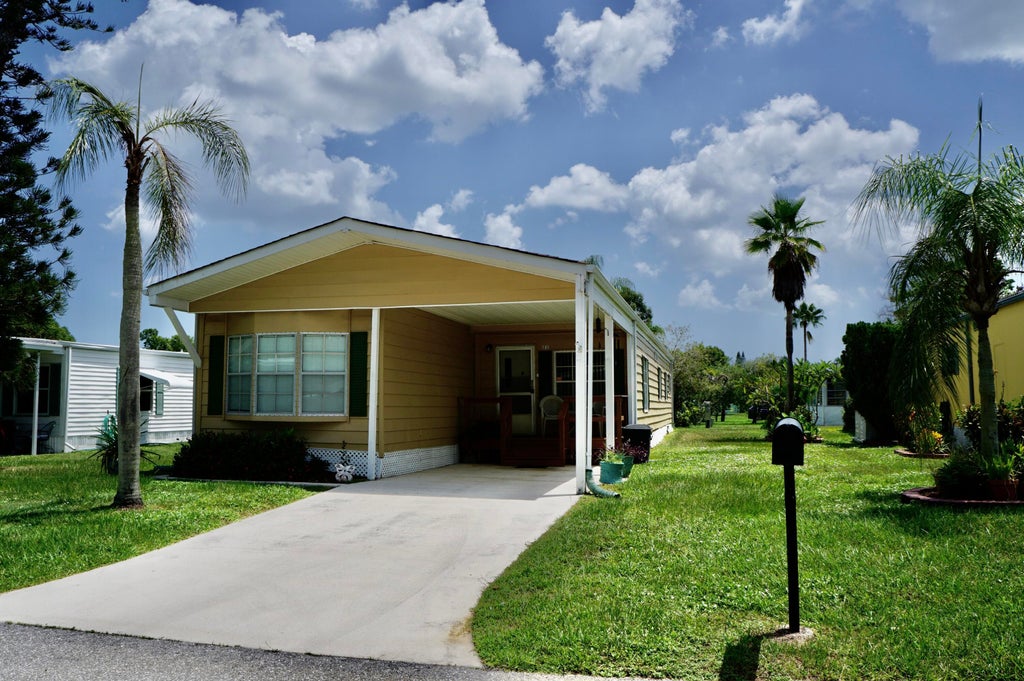 Photo of 21 SE Iberian Lane, Port Saint Lucie, FL 34952 (MLS # B26065846)