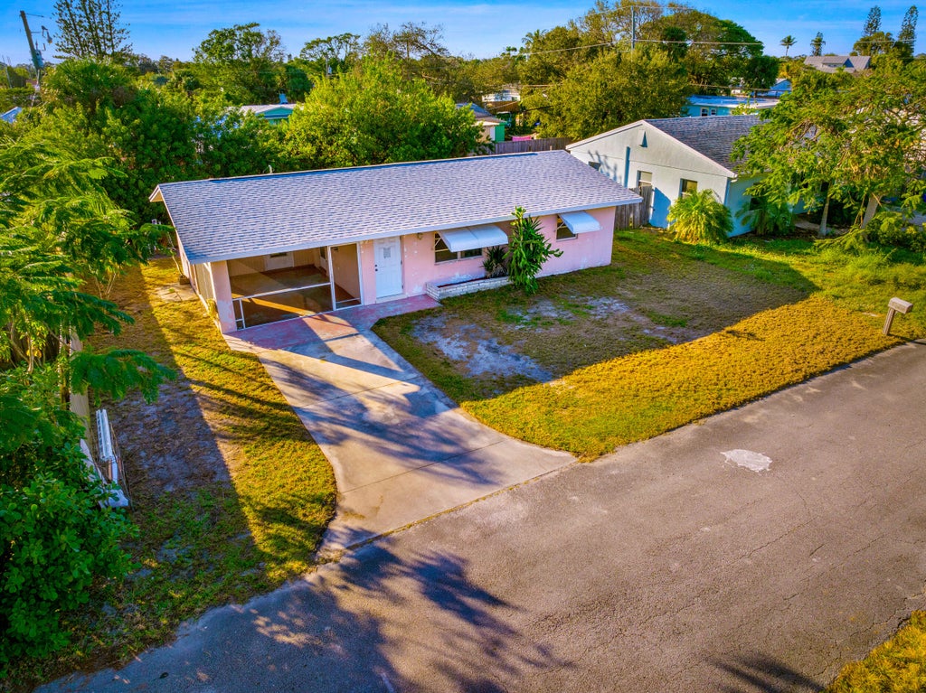 Photo of 1772 NE 23rd Drive, Jensen Beach, FL 34957 (MLS # R11060929)