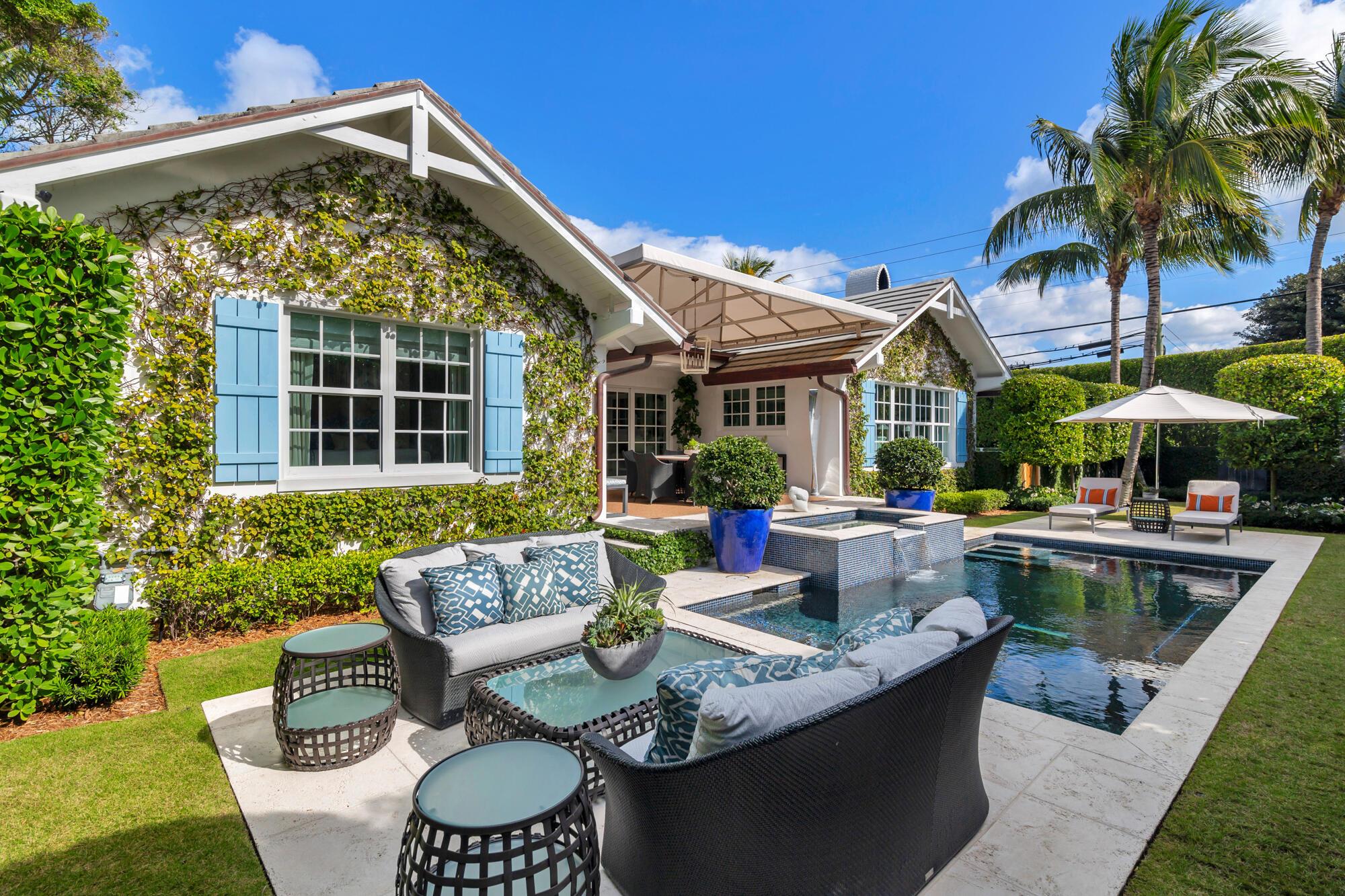 Completely renovated jewel box in the heart of town, this 3-bedroom, 2.5-bathroom home with an office is situated on a spacious 10,000-square-foot lot. Featured in Luxe magazine, the residence boasts an open layout with abundant natural light, southern sun exposure, and a custom-built bar perfect for entertaining. The spacious kitchen, featuring Calcutta Gold marble, opens to a covered loggia that overlooks the impeccably landscaped garden and pool. Additional highlights include vaulted ceilings, a private master bedroom veranda, and a one-car, air-conditioned garage. Enjoy the private pool, spa, and oversized yard, along with access to a private beach and the scenic Lake Trail. Just a short walk to Worth Avenue, The Four Arts, and the recreation center, this home offers the ultimate