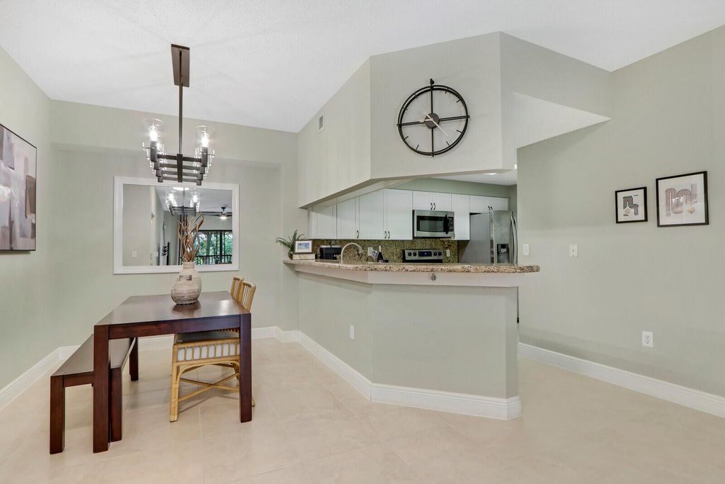 Photo of 3023 Alcazar Place #302, Palm Beach Gardens, FL 33410 (MLS # R11050927)