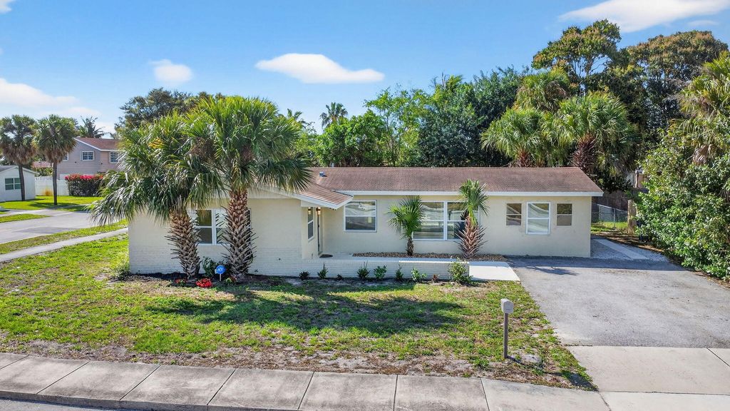 Photo of 371 W 34th St, Riviera Beach, FL 33404 (MLS # B26000398)
