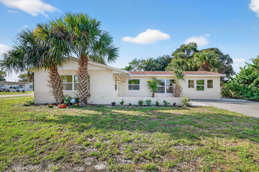 Photo of 371 W 34th St, Riviera Beach, FL 33404 (MLS # B26000398)