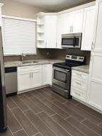 Come see this completely updated, large townhome, with a 1 car garage, located in the nice central park location of Plantation. The kitchen has brand new cabinets, granite countertops and newer appliances. All new porcelain wood plank tile throughout main living area. There is a nice sized screened in patio off the living area. All new carpet in the bedrooms, bathrooms are completely updated from the cabinetry, to the granite tops, and tiled shower. Entire unit has been painted. Full size washer/dryer in the unit and plenty of closet space. Beautifully maintained community that features a community pool.