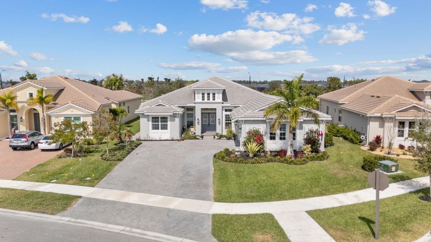 OWNER WILL CONSIDER SOME FINANCING @4.5% 4 BEDS, 4. 5 BATH RESIDENCE ON AN EXPANSIVE 13,872 SQFT FENCED LOT LOCATED IN THE ESTATES, PRESTIGIOUS GATED COMMUNITY FEATURING ONLY 77 HOMES WITH SOME OF THE LARGEST LOT SIZES IN THIS DEVELOPMENT.  LESS THAN 2 YEARS OLD, UPGRADES. PORCELAIN TILE, SECURITY CAMERAS, IMPRESSIVE ARCHITECTURAL DETAILS APPROXIMATELY 18-FOOT TRAY CEILINGS AT THE GRAND ENTRY. A DOUBLE LANAI, (POTENTIAL FOR A FUTURE CASITA) & THE OPEN FLOOR PLAN FLOWS BEAUTIFULLY & CAN EASILY BE A PRIVATE IN-LAW SUITE TO SUIT YOUR FAMILY'S NEEDS. THIS RESIDENCE OFFERS LUXURY LIVING AT ITS FINEST.  ENJOY RESORT-STYLE AMENITIES AT WESTLAKE ADVENTURE PARK INCLUDING AN OVERSIZED LAGOON POOL, & A HEATED ADULT ONLY POOL, PLAYGROUND, SPLASH PAD, DOG PARK, BASKETBALL COURTS, & MORE.