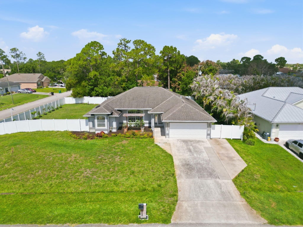 Photo of 102 NW Peach Street, Port Saint Lucie, FL 34983 (MLS # B26041442)