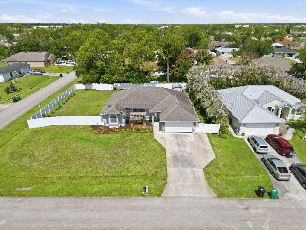 Photo of 102 NW Peach Street, Port Saint Lucie, FL 34983 (MLS # B26041442)