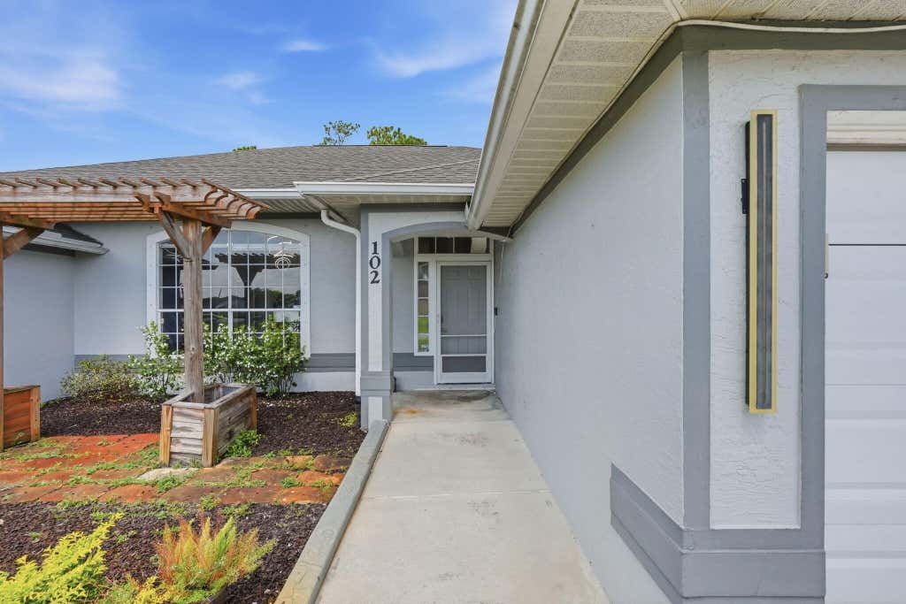 Photo of 102 NW Peach Street, Port Saint Lucie, FL 34983 (MLS # B26041442)
