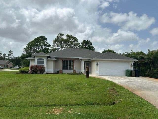 Photo of 102 NW Peach Street, Port Saint Lucie, FL 34983 (MLS # B26041442)