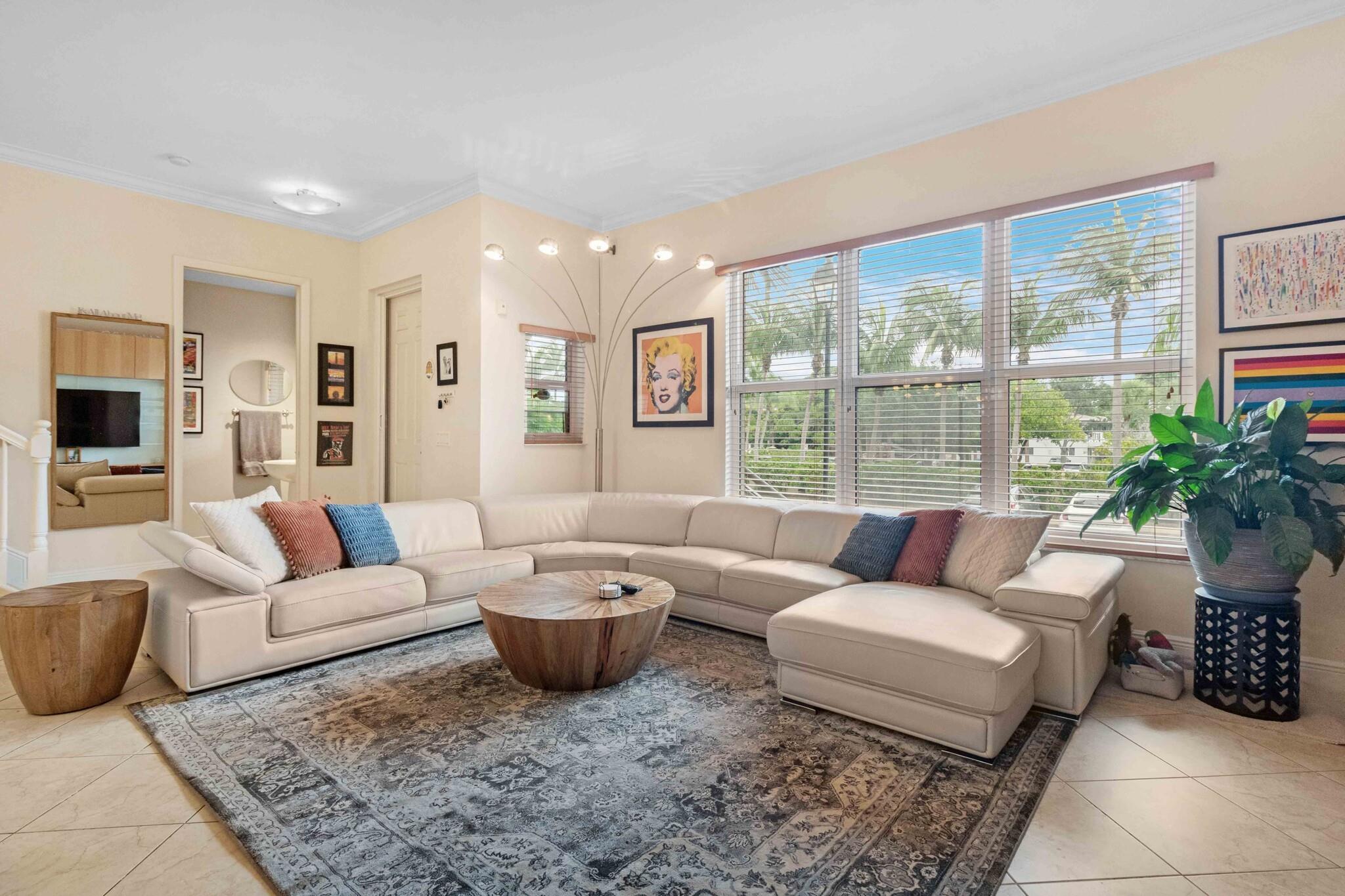 Resort style living in the heart of Wilton Manors! 2 bedroom 2.5 bath w/ additional office or den. This townhome enjoys east facing exposure for morning sunlight and offers privacy with no neighboring buildings in view. Main living area is bright and spacious with a custom designed entertainment wall unit. The kitchen features bar seating, recently refaced 42” cabinetry, and the refrigerator/dishwasher were replaced in 2022. Guest and primary bedroom both have newly installed luxury vinyl floors & refaced cabinetry in the bathrooms. NEW AC, hot water heater, & washer/dryer (2022). Centrally located just seconds from Wilton Drive. HOA includes all amenities, 24hr security, 24hr gym, expanded cable w/ premium channels, high speed internet, reserves, insurance, roofs, everything but electric!