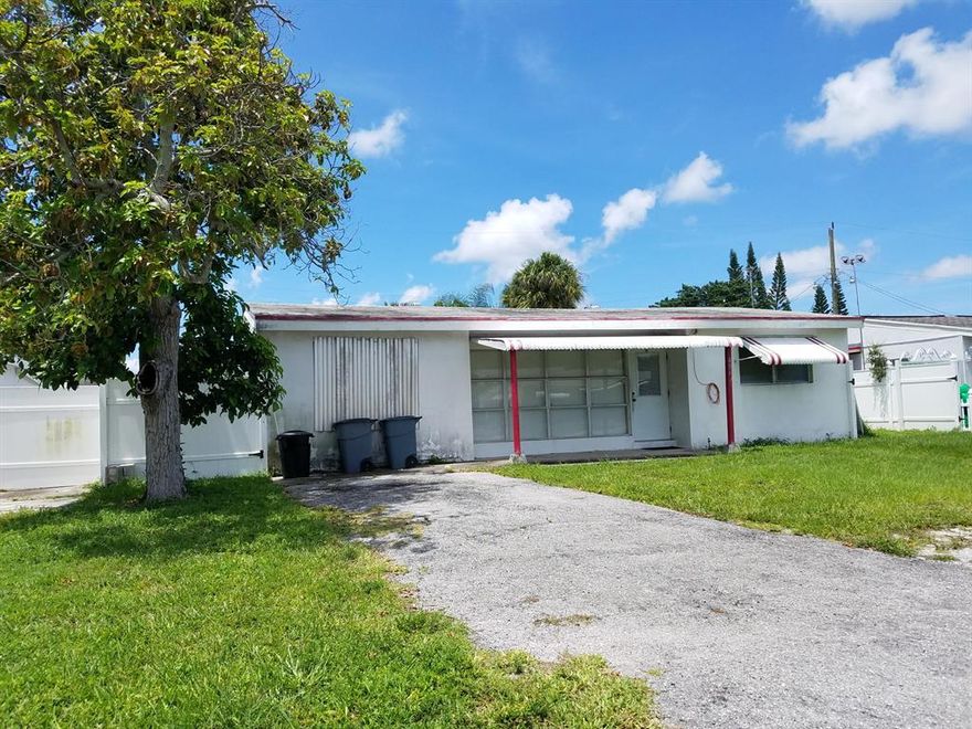 ''AS Is'' Investor Special selling below market value within minutes to down town West Palm Beach, airport, shopping and beaches!  Great sized lot perfect for expansion or addition of pool. Motivated seller to the highest offer. All measurements' are approximated.