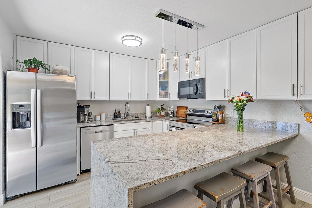 Photo of 226 Lake Arbor Drive, Palm Springs, FL 33461 (MLS # R11138595)