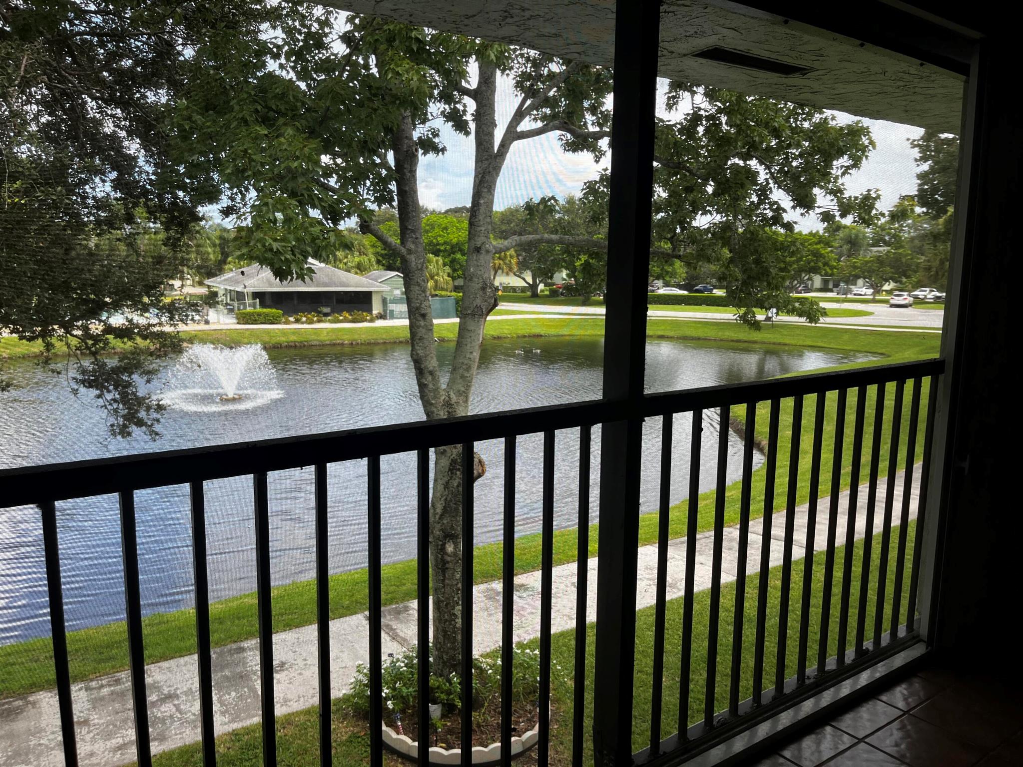 Beautiful Condo overlooking Lake and fountain. Updated light and bright kitchen with brand new stainless refrigerator and dishwasher. Lovely granite countertops w/ center island. This condo features vaulted ceiling in living room area well as wood-like flooring throughout the entire condo.! Extra Bonus room for storage or computer. Private screened in porch with an incredible views of lake and additional closet for storage. Community has a pool, clubhouse, tennis and basketball courts, and walking paths. Location only minutes to The Gardens Mall, shopping entertainment, restaurants, turnpike and I 95 and so much more!