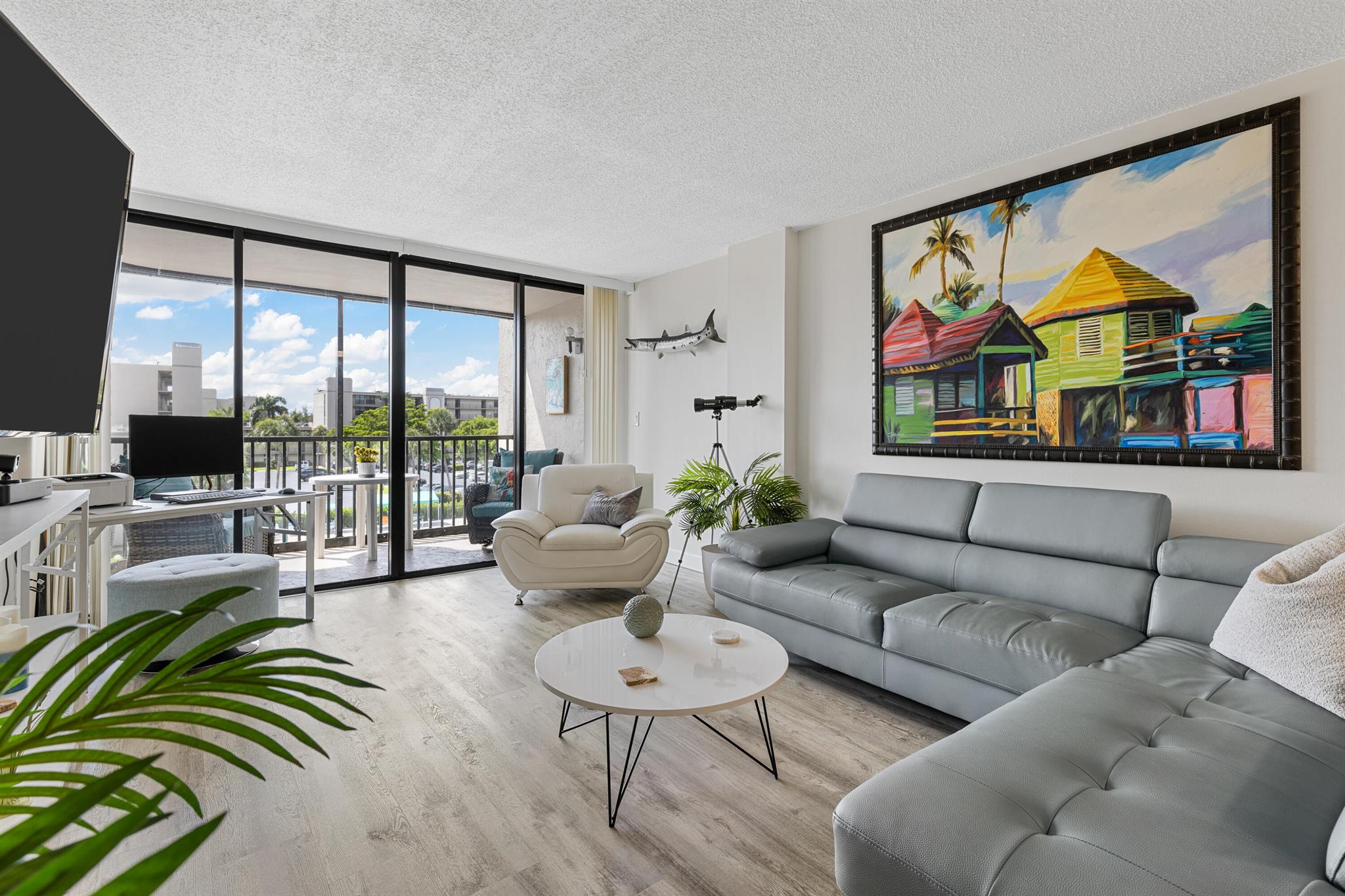 Gorgeous updated furnished annual rental with water views in manned gated community close to Mizner Park, downtown shops, restaurants and beaches. Completely turnkey with modern furniture & accessories, new linens, cooking utensils and more. Sip your morning coffee on the private screened balcony & enjoy the water view. Workout at the gym or take a walk around the community over its many bridges. Boca Bayou has 7 pools, 2 gyms, tennis and pickleball courts, sauna, BBQs, electric charging station & car wash areas. 24-hour manned gated secure community. Rent a dock if available. Enjoy the best of South Florida living!