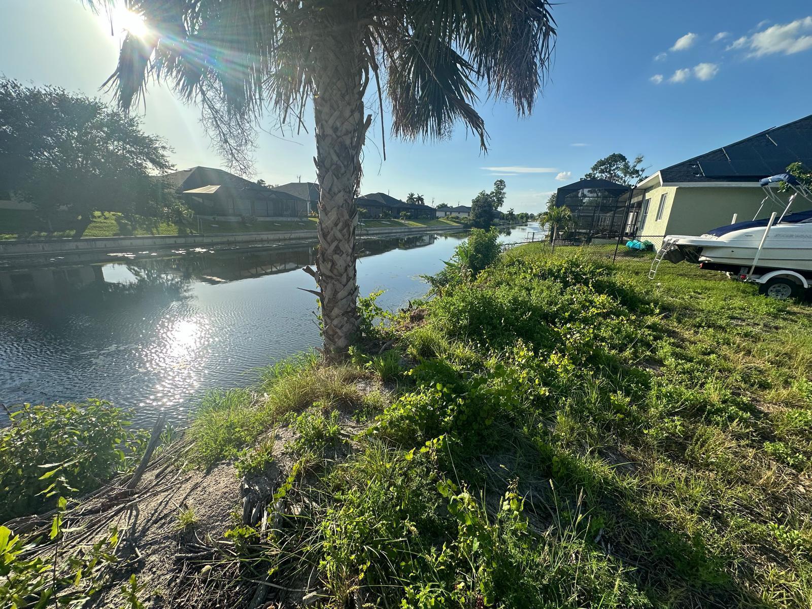 Build your dream home on this prime freshwater lot in the heart of Cape Coral! Cleared and Ready to Construct! This property features all utilities already in place, making it the perfect site for your future home or investment. Enjoy the mesmerizing sunsets from your backyard & explore miles of boating, kayaking, and jet skiing along the scenic canal system leading to Jolie Lake.Located in a desirable neighborhood of newer homes, this lot offers quick access to Pine Island Rd and Chiquita Blvd, just minutes from Publix, Target, Starbucks, and top dining options. Families will appreciate the proximity to Patriot Elementary and Challenger Middle School, while outdoor enthusiasts can take advantage of nearby Saratoga Lake Park and Strausser BMX Sports Complex.