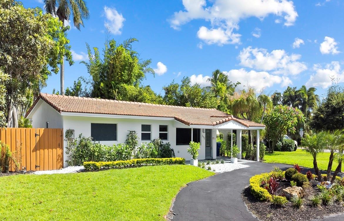 Welcome to this stunningly reimagined home nestled in the sought-after Tropical Manors neighborhood of Wilton Manors. Located on a quiet, tree-lined street, this beautifully updated residence offers comfort, style, and privacy. Inside, the home features an open floor plan with sleek porcelain tile flooring throughout. The modern kitchen is a chef’s dream, complete with custom cabinetry, quartz countertops, and all-new appliances. Sliding doors off the dining area open to a private, landscaped backyard—fully fenced and with ample space to add a pool, perfect for relaxing or entertaining. The spacious primary suite includes a walk-in closet and a luxurious ensuite bath. Additional features include impact windows and doors and thoughtful updates that enhance both form and function.