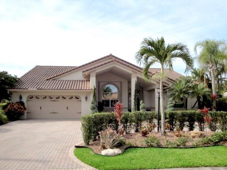 This stunning, waterfront home is impeccably maintained inside & out! Desirable features include: gorgeous elevation with paver circular drive; double door entry to foyer; laminate, "wood-look" flooring in all bedrooms; large, marble-look tile throughout main living area; desirable split bedroom plan; lovely kitchen with oak cabinets & Corian counters; huge master bedroom and bath with Roman tub & shower; crown molding; accordion shutters; paver patio & gorgeous free-form pool; and breathtaking lake views!
