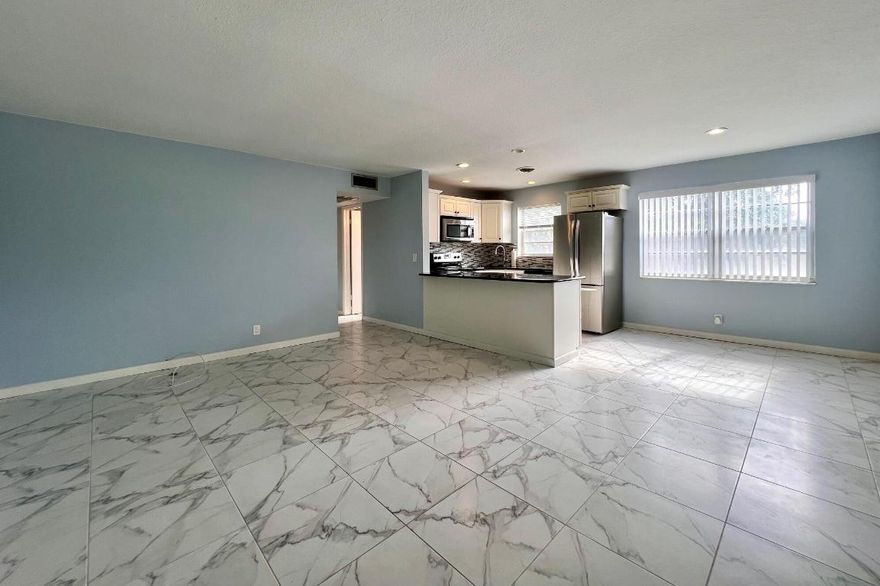 Beautifully Updated RENTAL in 55+ Century Village - Occupants Must Be 55+! Second Floor Corner 2/1.5 With Central AC &  Pretty Water Views. Gorgeous Open Living Area With Updated Kitchen. Updated Baths. Tile Flooring in Living Area.  Long Screened Lanai With Pretty Water Views.  Unfurnished. Close to Hastings Fitness Center. Move In Requirements: First, Last, and Security. Credit & Background Check. Association Application & Fee, Association Approval. Occupants Must be 55+.