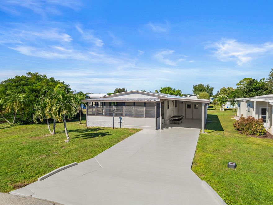 YOU OWN THE LAND! Enjoy affordable living with a low $169/month HOA in the active 55+ community of St. Lucie Falls. This beautifully updated 2 bed, 2 bath home features a **brand-new 2025 roof and A/C** for peace of mind. The remodeled kitchen shines with an open layout, center island, and breakfast bar, while wood-look tile floors flow throughout for easy care. Just two doors down from one of the clubhouses and heated pools, you'll love the convenience and vibrant lifestyle - bingo nights, dinner dances, holiday events, and more! Amenities include **two clubhouses, two pools, tennis, pickleball, bocce ball, and RV/boat storage. **Escape the cold winters or enjoy year-round sunshine in this friendly, welcoming community where neighbors quickly become friends.