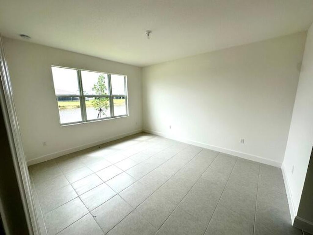 Photo of 11785 SW Oceanus Boulevard, Port Saint Lucie, FL 34987 (MLS # B26047671)