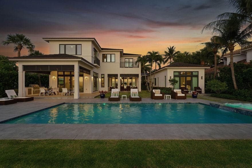 Welcome to an exceptional direct Intracoastal estate on exclusive Hypoluxo Island, masterfully built by renowned Hamptons builder Joseph Farrell. Showcasing timeless craftsmanship and effortless coastal sophistication, this five-bedroom, five-and-one-half-bath residence offers the perfect balance of luxury, comfort, and South Florida lifestyle.    Perfectly positioned on 100 feet of west-facing Intracoastal frontage, the property captures breathtaking sunset views and provides private dockage for a large vessel with convenient access to the ocean. The home's elegant interior is introduced by a dramatic two-story foyer and features expansive living spaces, oversized impact glass windows, elevated designer finishes, a state-of-the-art gourmet kitchen, and a desirable first-floor primary  suite designed for both privacy and convenience.    Outdoor living is equally spectacular, with an expansive entertaining terrace, summer kitchen, heated resort-style pool, and multiple spaces designed to maximize the extraordinary waterfront setting. Located just minutes from Eau Palm Beach Resort & Spa, Palm Beach, and the finest dining, shopping, and coastal amenities, this residence offers a rare opportunity to experience luxury waterfront living in one of Palm Beach County's most exclusive island communities.