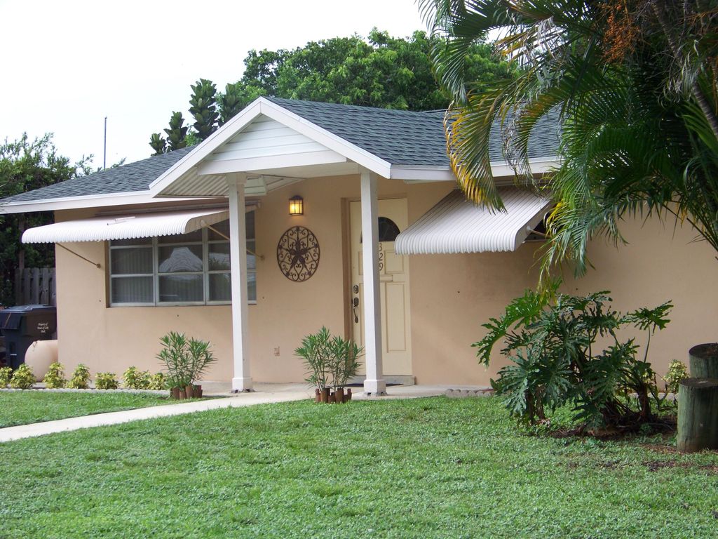 Photo of 329 Greenbriar Drive, Lake Park, FL 33403 (MLS # R10788336)